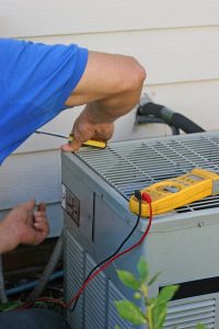 technician working on air conditioner
