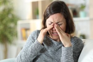 woman-suffering-from-dry-eyes-sinus-problems